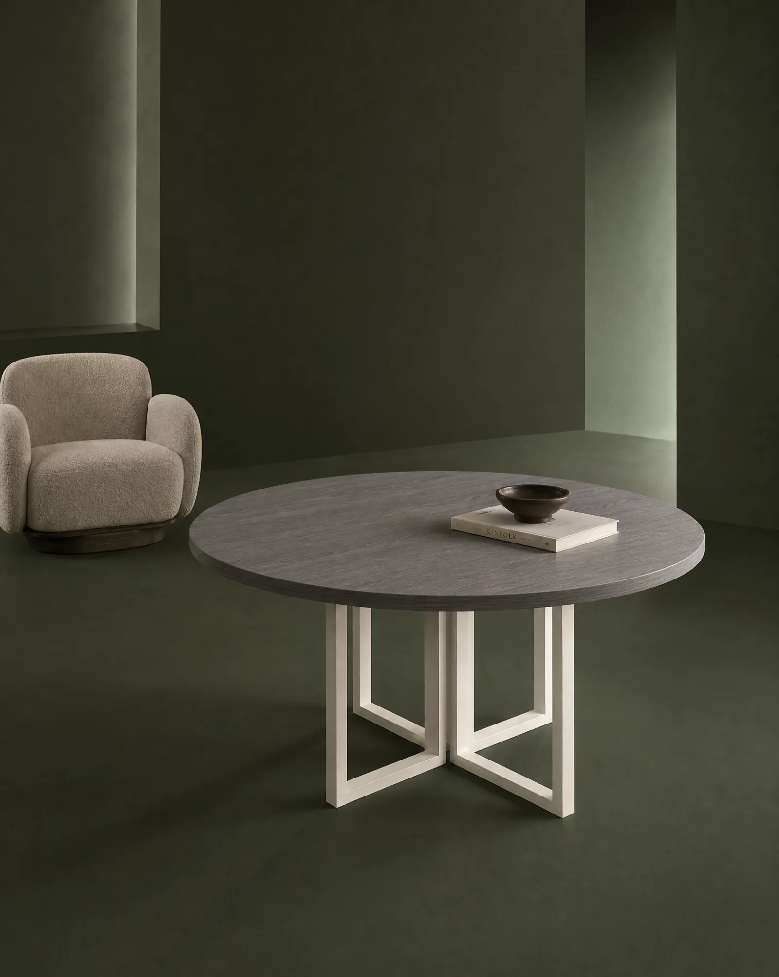 Ultra round table with lounge chairs on a moss set