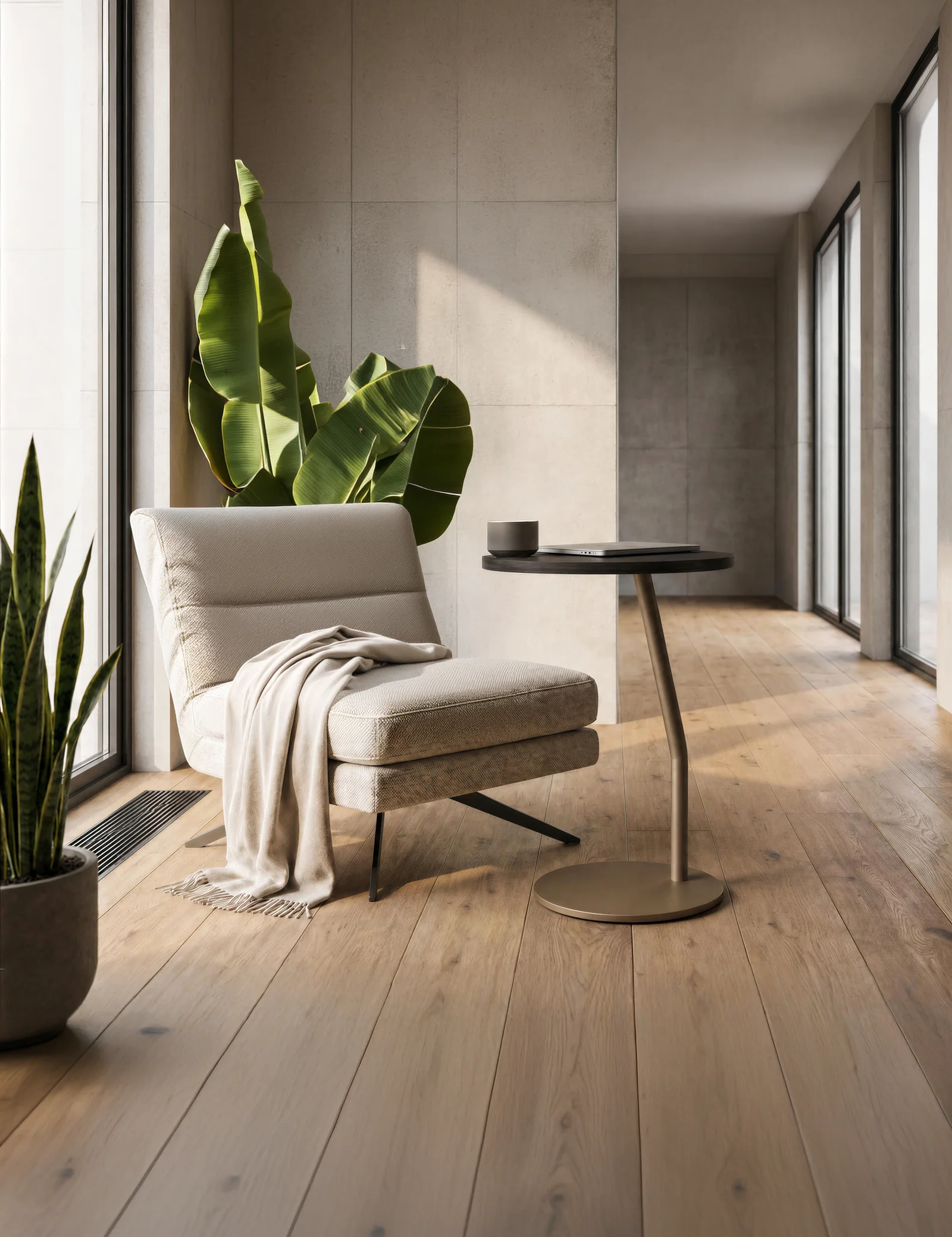 App side table beside a lounge chair in a sunlit concrete room